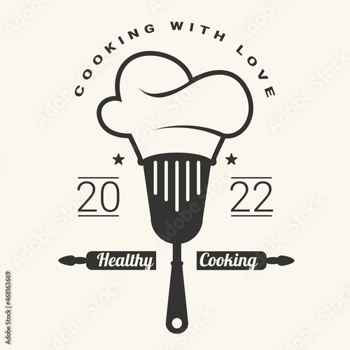 Cooking with love logotype with  spatula and chef hat. Healthy cooking. Vector illustration.
