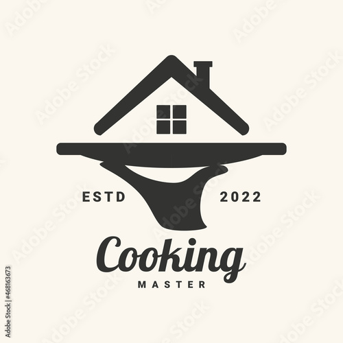 Cooking at home logotype with hand and house on the tray. Vector illustration.