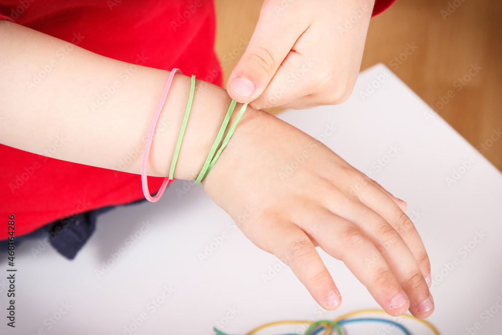 Preschooler playing with rubber erasers. Development of kids motor skills, coordination and logical thinking Preschooler playing with rubber erasers. Development of kids motor skills, coordination and logical thinking