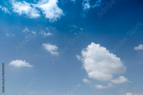 The clear blue sky had white clouds at midday. Use as background  poster