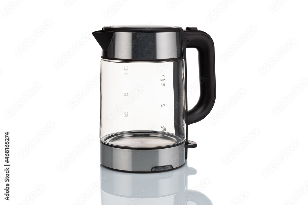 Glass, electric, modern transparent kettle on a white background. Close-up. Glass, electric, modern transparent kettle on a white background. Close-up.