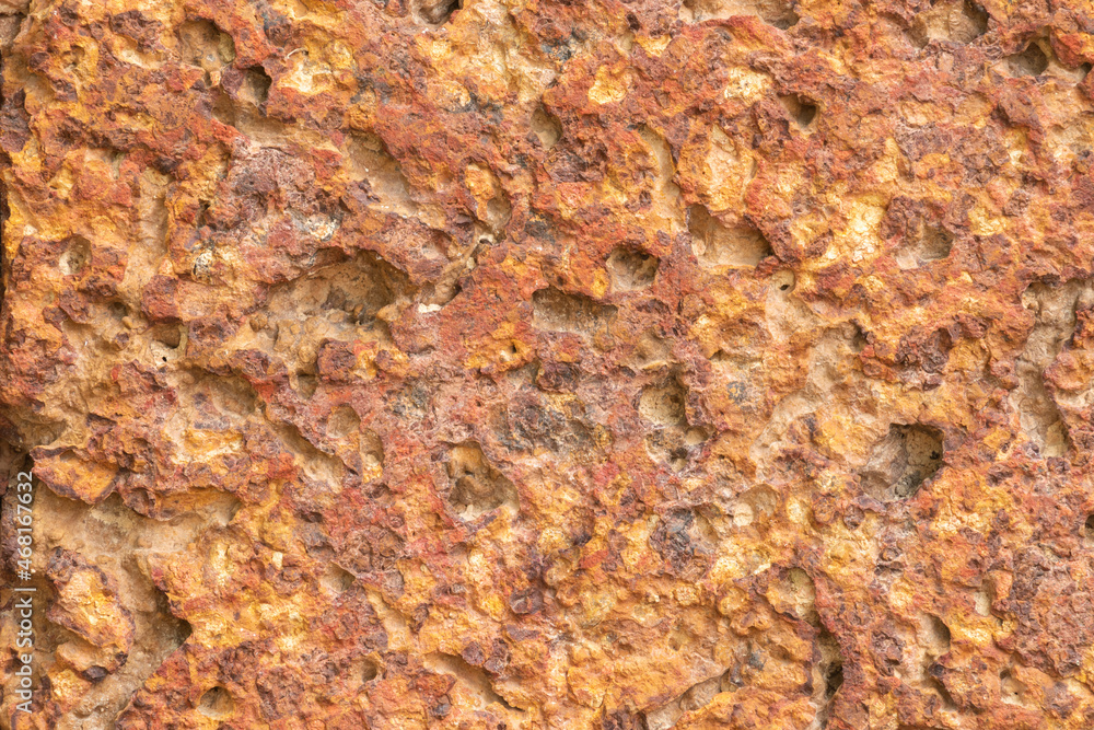 blur of red laterite brick wall Porous and fine-grained Background pattern blur of red laterite brick wall Porous and fine-grained Background pattern