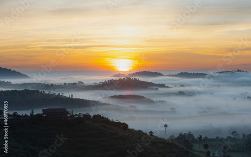 Morning mountain view with sea of fog and sunrise sky.
