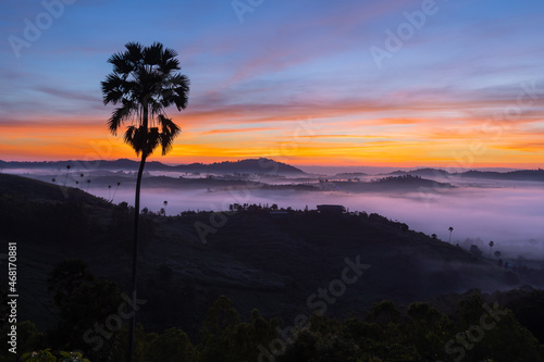 Morning mountain view with sea of fog and sunrise sky.