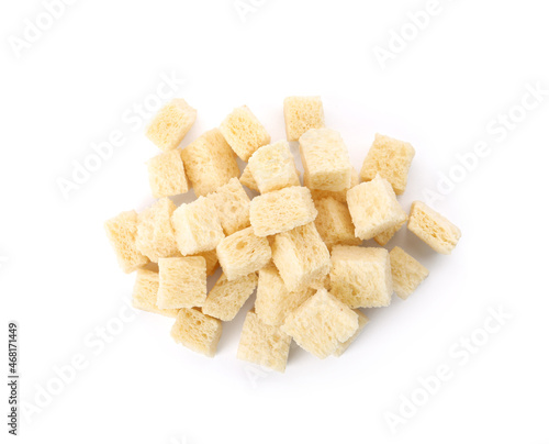 Heap of crispy croutons on white background, top view