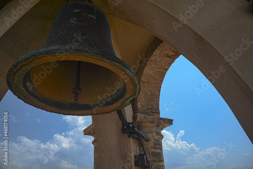 Bell inside the famous old historic Alcazaba Moorish fortress in Antequera, Spain photo