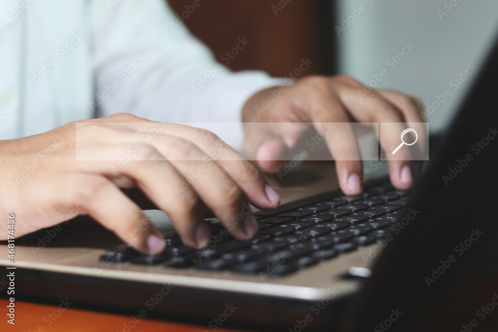 Data Search Technology Search Engine Optimization. man's hands are using a computer notebook to Searching for information. Data Search Technology Search Engine Optimization. man's hands are using a computer notebook to Searching for information.