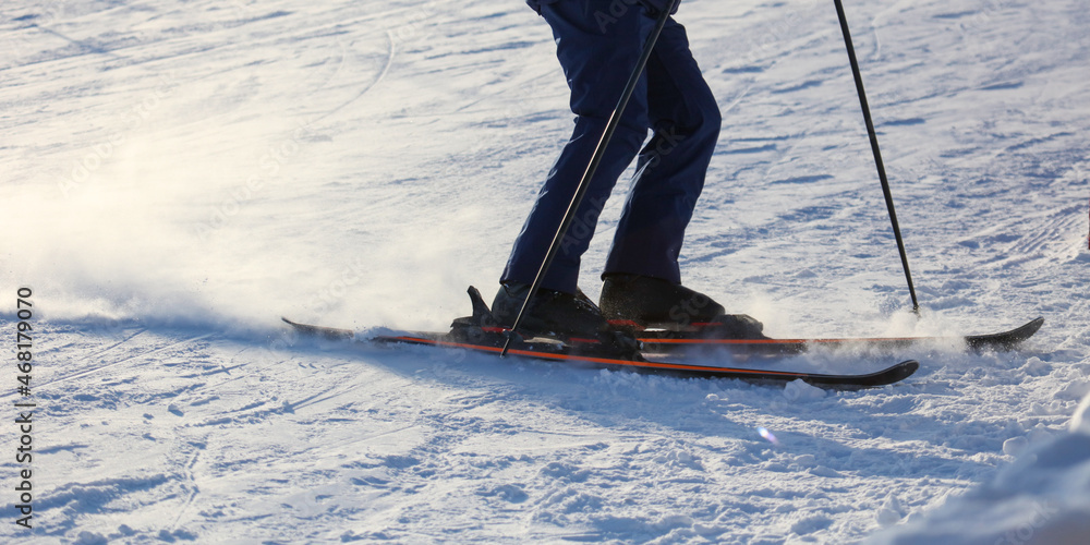 A man is skiing in the snow A man is skiing in the snow