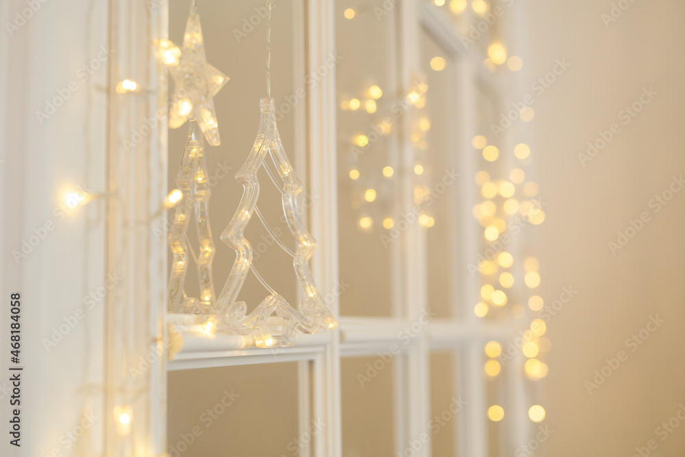 new year holiday lights on the window new year holiday lights on the window