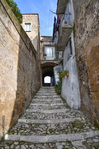 Fototapeta Naklejka Na Ścianę i Meble -  A narrow street in Caiazzo, a small village in the mountains of the province of Caserta, Italy.