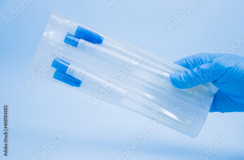 Sterile cotton swab in blue sterile pack with sterile tube