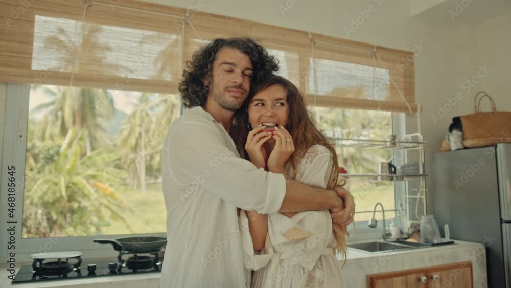 custom made wallpaper toronto digitalYoung happy active married couple dancing laughing together cooking meals at home, carefree joyful husband and wife have fun cooking healthy breakfast food in boho styled kitchen