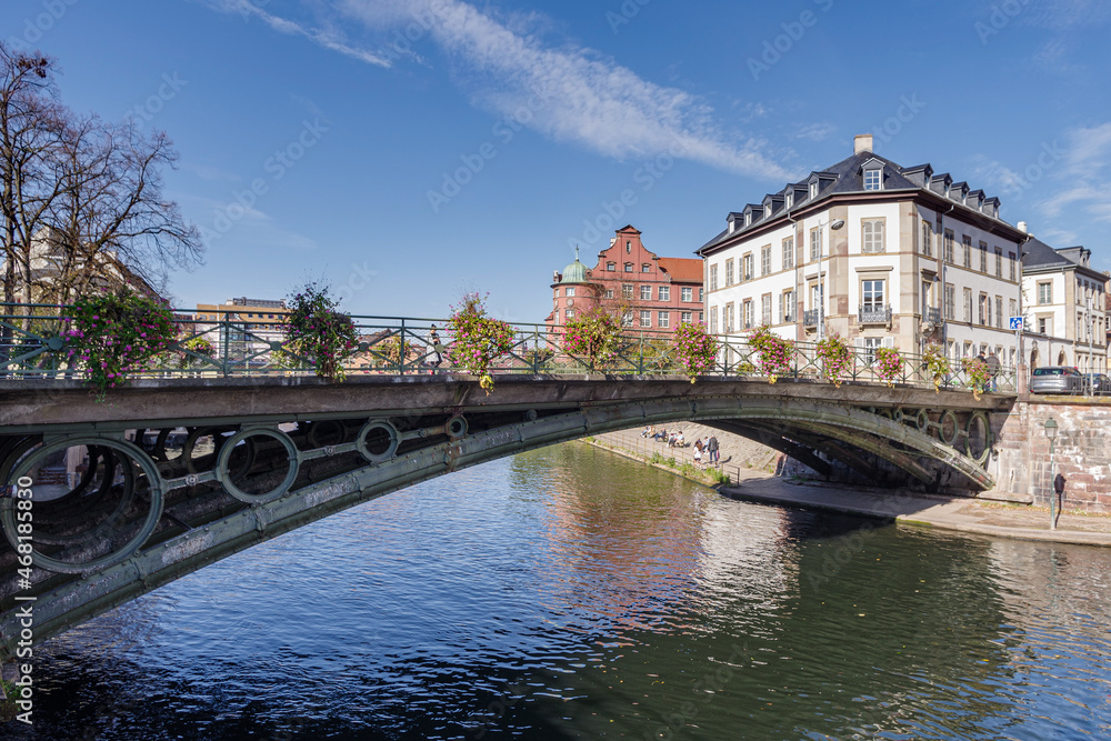 France, Strasbourg, Ill River canal with promenade and row of townhouses