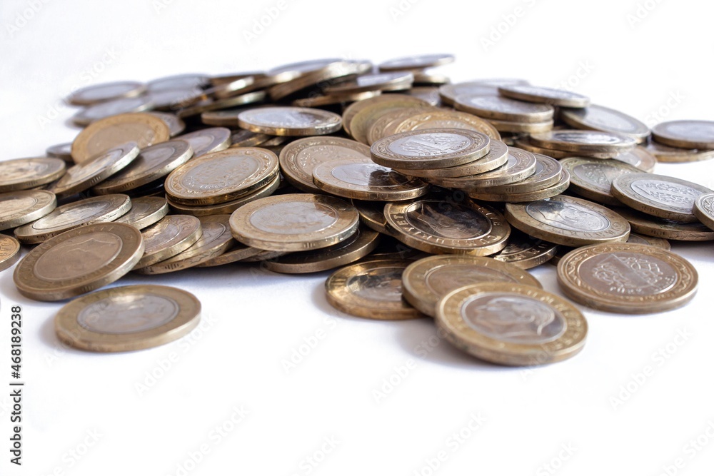 Stack of Turkish lira coins isolated on white background.