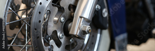 Closeup of brake disc on motorcycle wheel © H_Ko