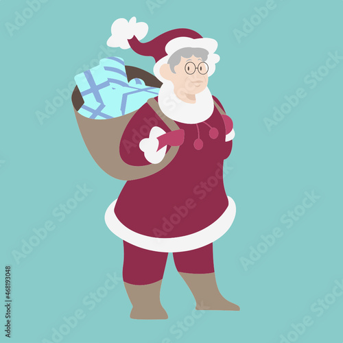 Mère Noël en route pour distribuer les cadeaux. Distribution des cadeaux de Noël. Mamie déguisée en Mère Noël.