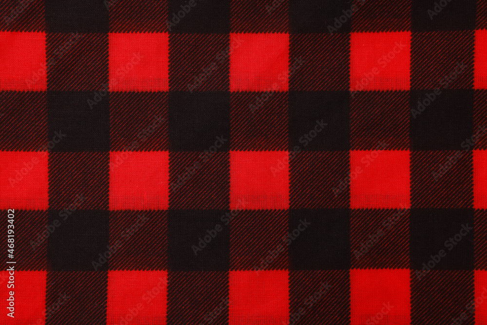 Top view of red bandana with check pattern as background Top view of red bandana with check pattern as background