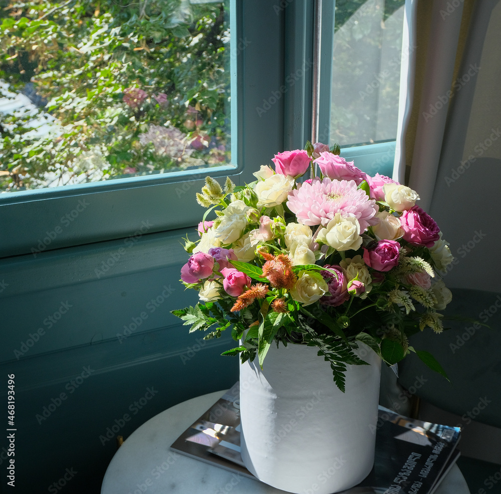 Beautiful bouquet of fresh flowers on the table near the window. Home decoration. flower shop concept