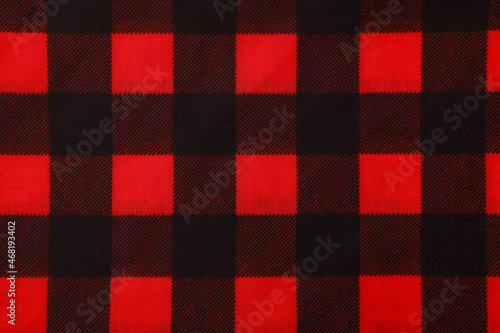 Top view of red bandana with check pattern as background