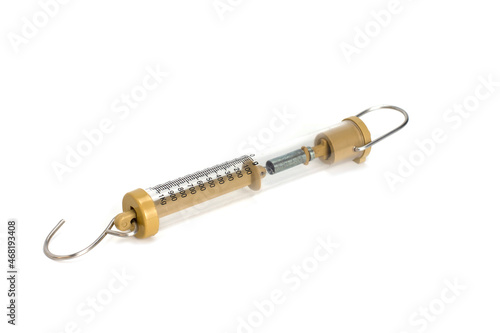 Compact spring balancer with hook isolated on a white background