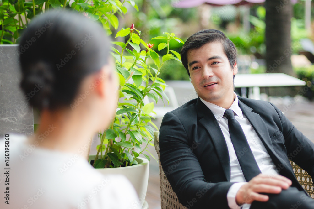 professional business partner person talking together, man and woman working in urban city professional business partner person talking together, man and woman working in urban city
