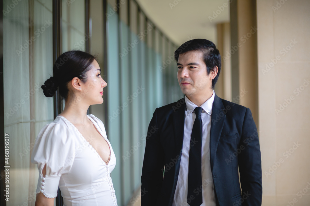 professional business partner person talking together, man and woman working in urban city professional business partner person talking together, man and woman working in urban city