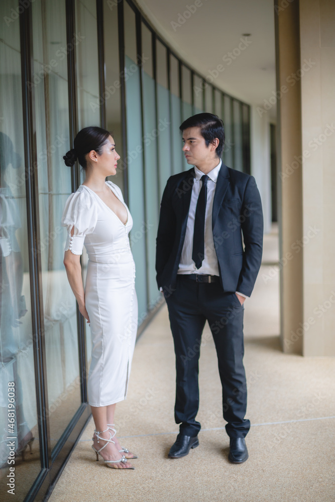professional business partner person talking together, man and woman working in urban city professional business partner person talking together, man and woman working in urban city