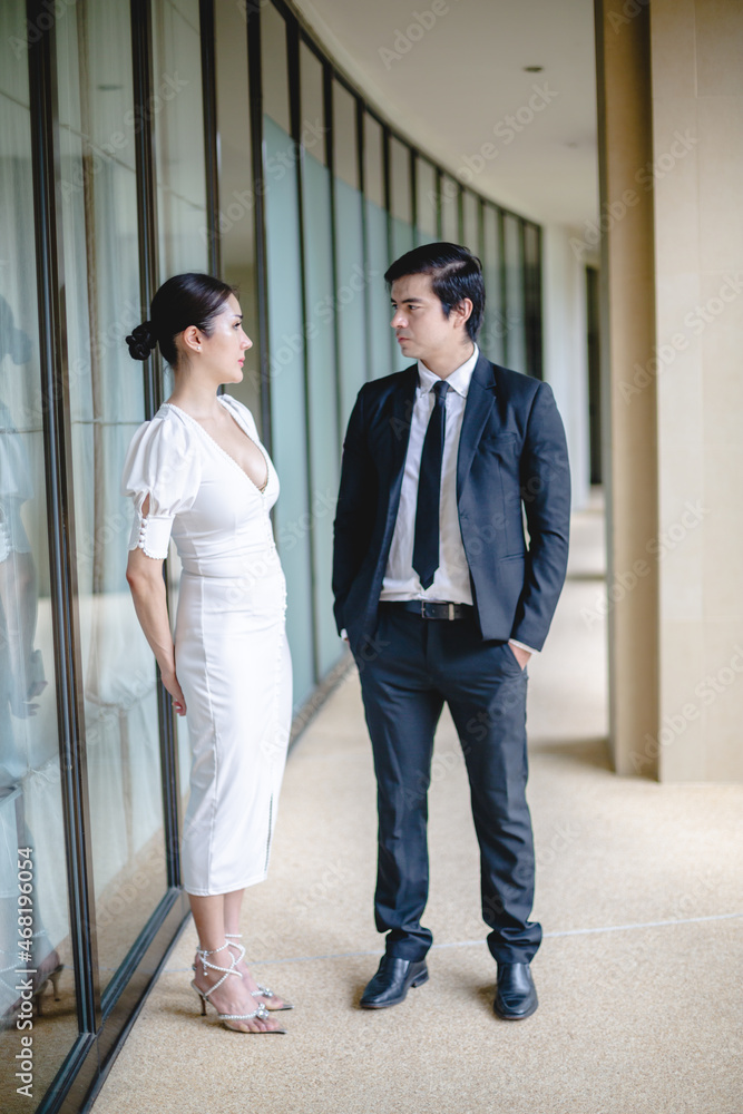 professional business partner person talking together, man and woman working in urban city professional business partner person talking together, man and woman working in urban city