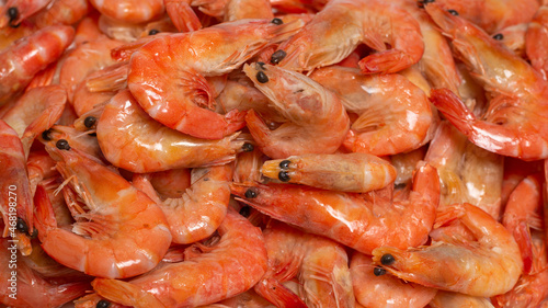 Shrimps background texture. A lot of shrimps. Cooked shrimps.