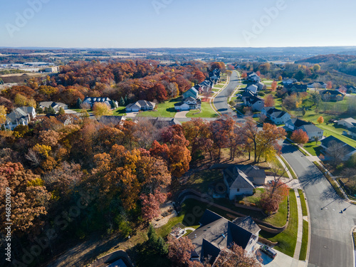 Aerial view of Eau Claire, Wisconsin, residential neighborhood in autumn.  Wide streets with curbs and sidewalks. Large homes and yards.  Park nearby. photo