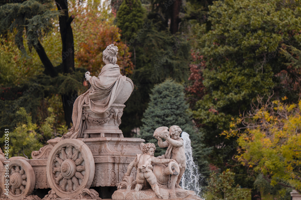 Cibeles Square in Madrid against autumn color plants