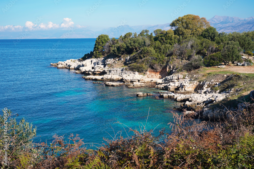 picturesque rocky seashore near Pipitou beach in Kassiopi, Corfu island, Greece