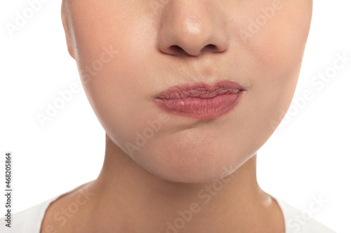Woman rinsing her mouth on white background, closeup. Dental care