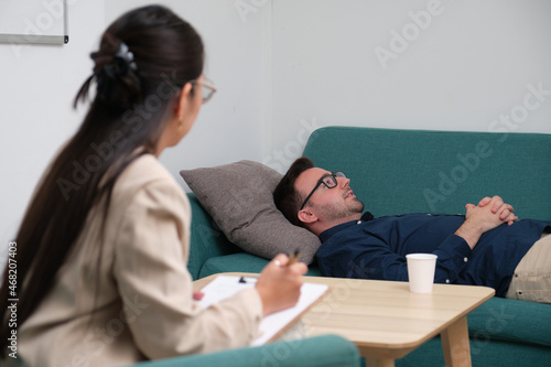Asian female psychologist conducting a consultation.