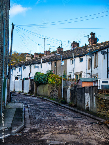 Typical Back street behind houses , each house had a yard and a wall behind. Notice the cobbled road which was a feature of Padiham in Lancashire which has been retained in the Conservation area