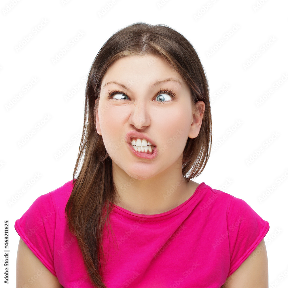 Teenage girl grimacing,girl making funny grimaces by clenching her teeth - obrazy, fototapety, plakaty 