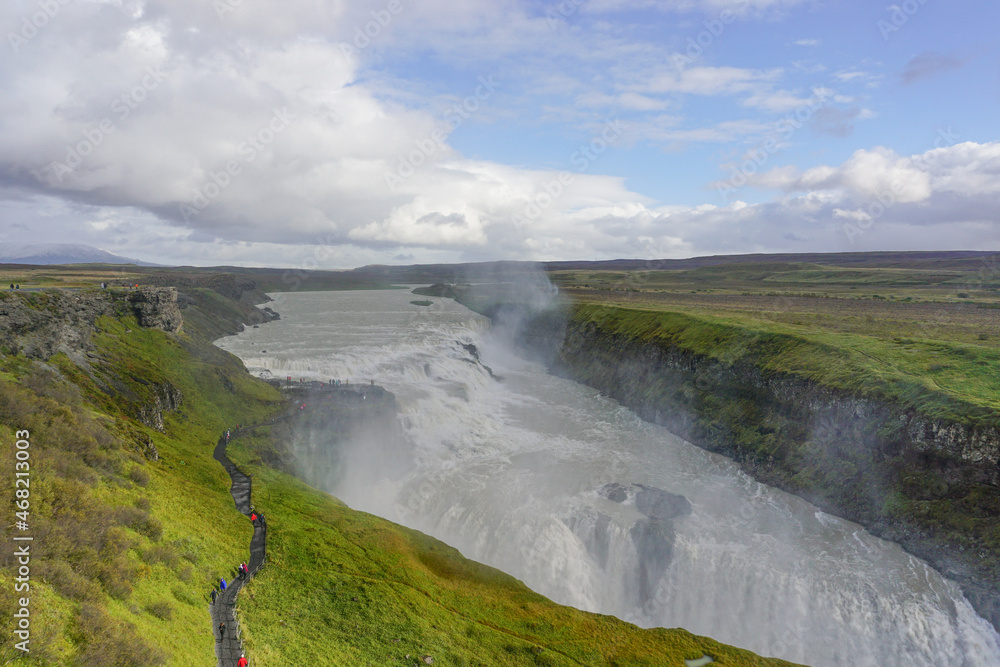 Southwest Iceland: Visitors walk along a trail as mist rises from Gullfoss (Golden Falls), the most famous waterfall in Iceland. Southwest Iceland: Visitors walk along a trail as mist rises from Gullfoss (Golden Falls), the most famous waterfall in Iceland.