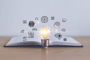 Bright light bulb and icon with book. Business and education concept