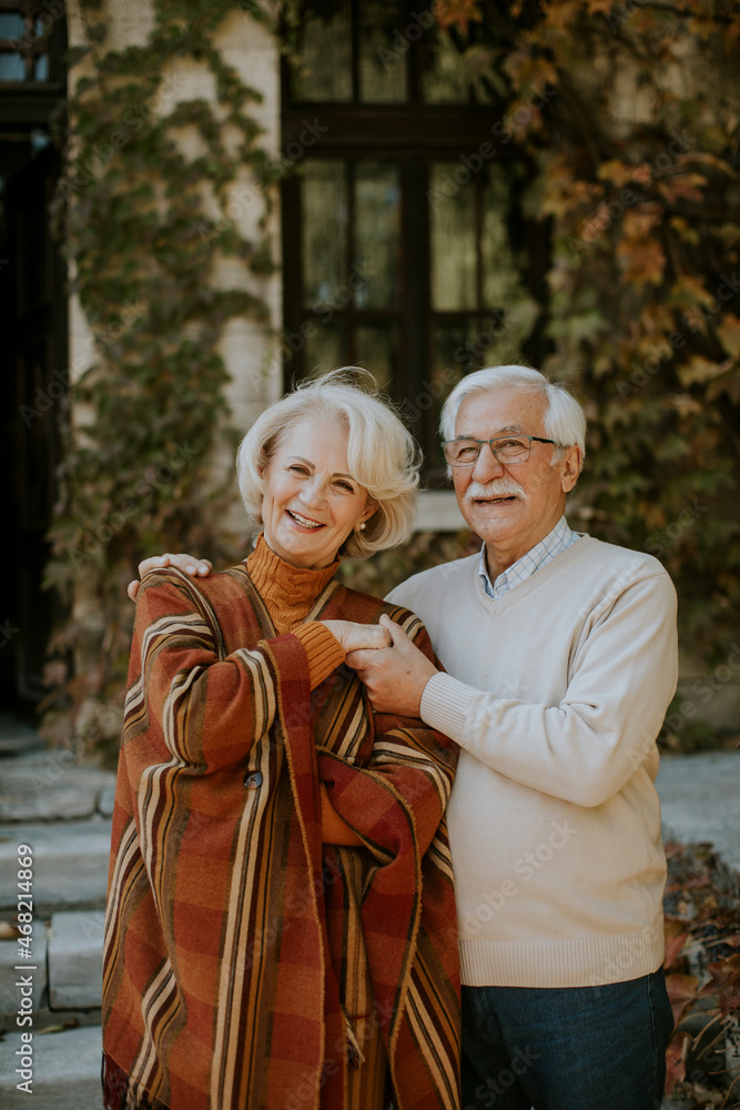 Senior couple embracing in autumn park