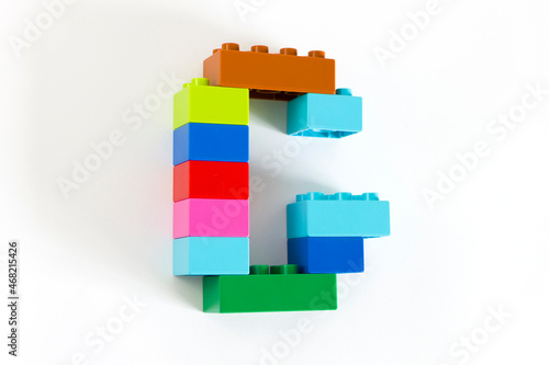 Colorful toy brick letter G