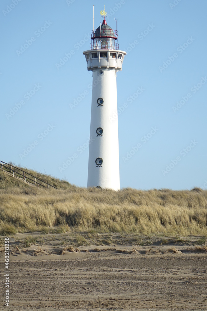 J. C. J. van Speijk Lighthouse seen from the beach on a cold and sunny winter day, Egmond aan Zee, North Holland, Netherlands
