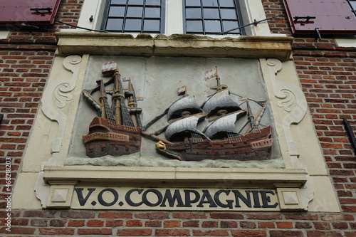 Relief with ships memorizing the historical Vereenigde Oostindische Compagnie (Dutch East India Company, United East India Company) on a red brickstone wall, Hoorn, North Holland, Netherlands
