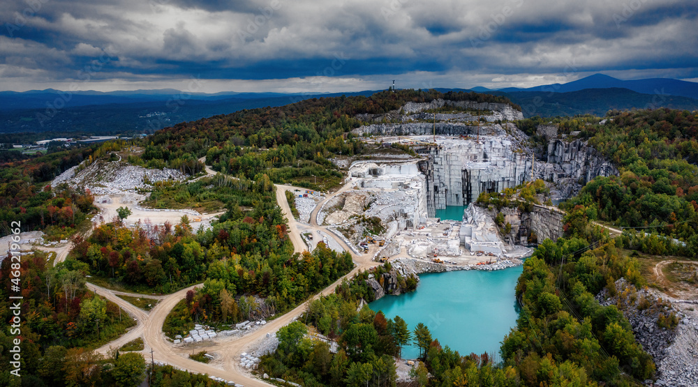 Aerial of Ages - A drone shot of this beautiful granite quarry in Vermont.  With stunning, turquoise water,  which gets its color from the fallen granite pieces.