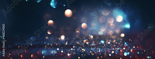 Świąteczny brokat z blaskiem światełek i gwiazd. Niebieskie i brązowe tło