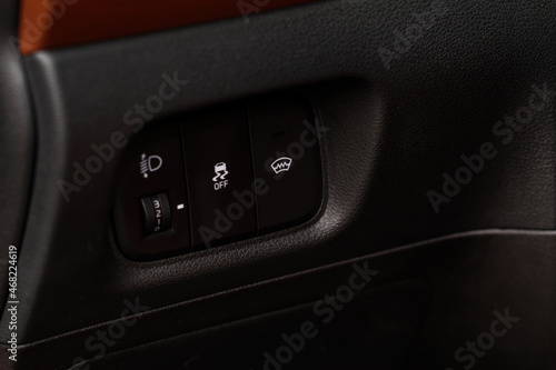Close up view of modern car electronic safety systems control panel. Modern car interior detail. © Roman