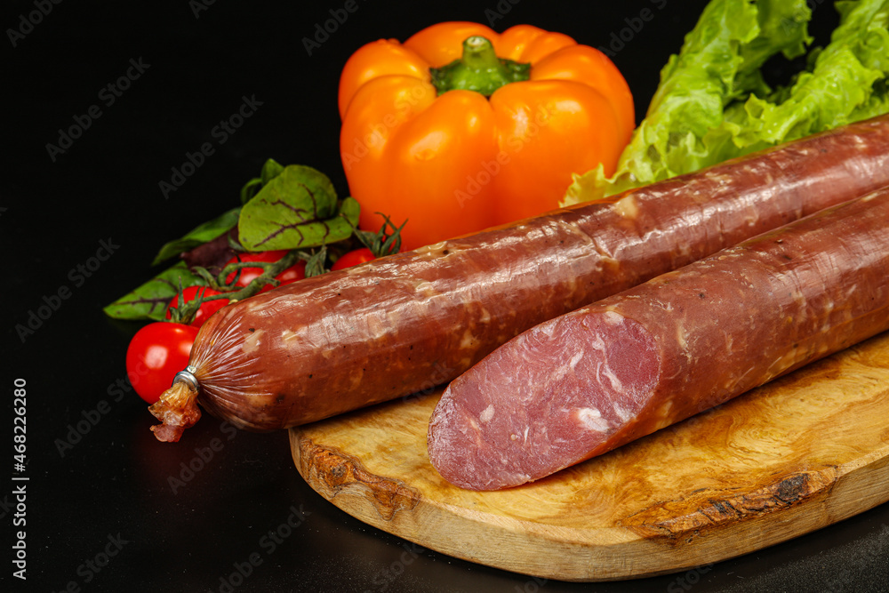 Pork ham sausage cut isolated