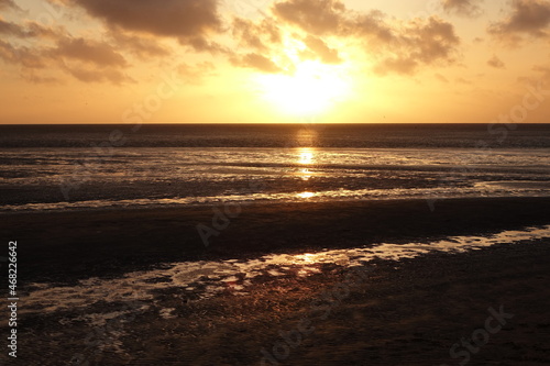 Sunset over Sahlenburg beach and the wadden seas on a spring evening, Sahlenburg, Cuxhaven, Lower Saxony, Germany 