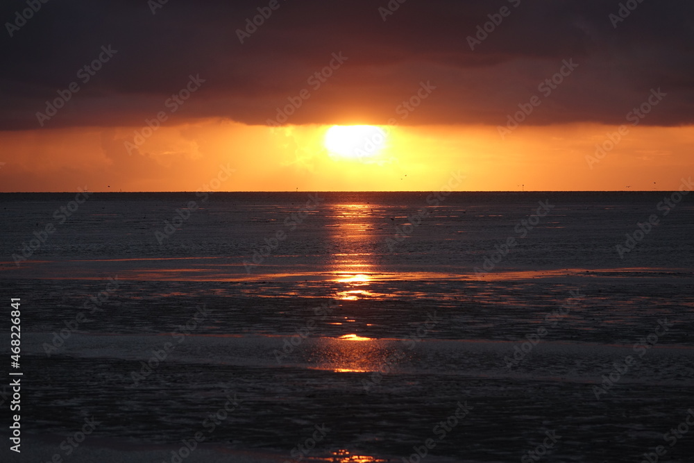 Sunset over Sahlenburg beach and the wadden seas on a spring evening, Sahlenburg, Cuxhaven, Lower Saxony, Germany
