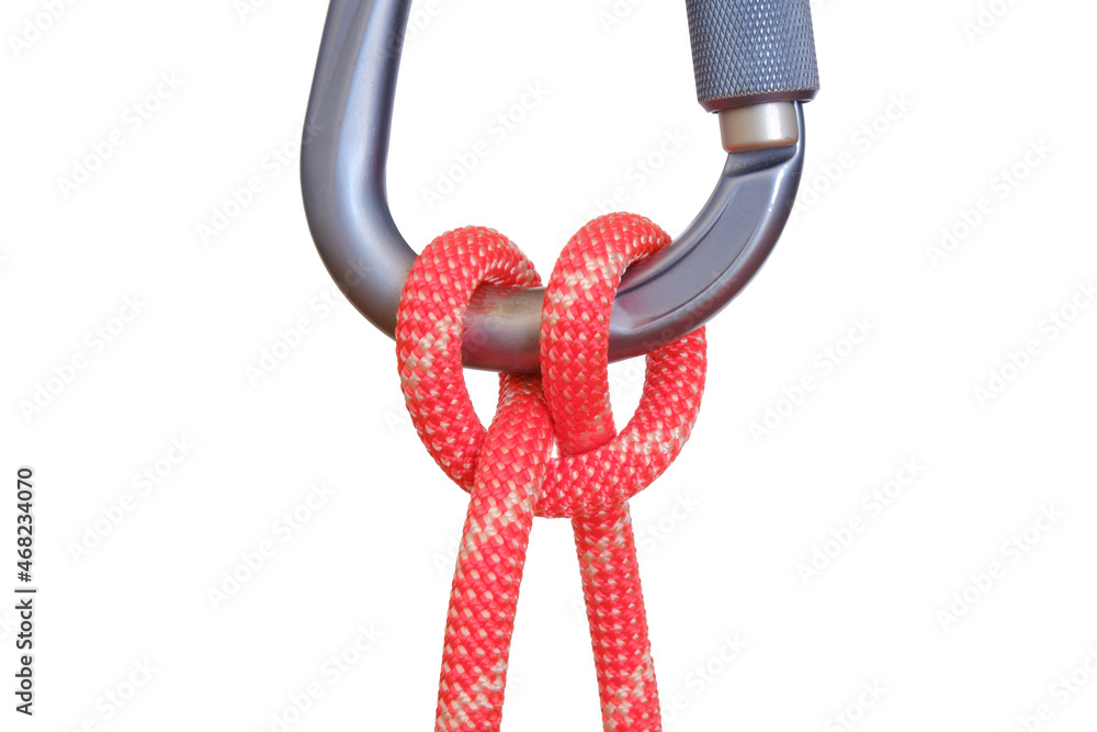 Clove hitch tied with red rope on carabiner, isolated on white background. This clove hitch knot used in climbing is called Mastwurf in German and Noeud de cabestan in French.
