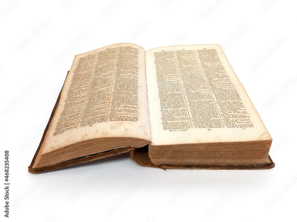 Obraz premium Aerial view of open vintage book on white background. Close up of old ancient book isolated. Antiques and collectibles.